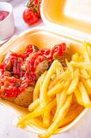 grilled bratwurst with French fries and ketchup
