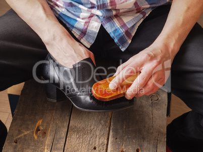 Man cleaning shoes