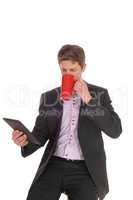 Business man drinking his coffee in a suit