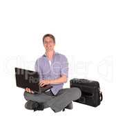 Man sitting on floor with his laptop