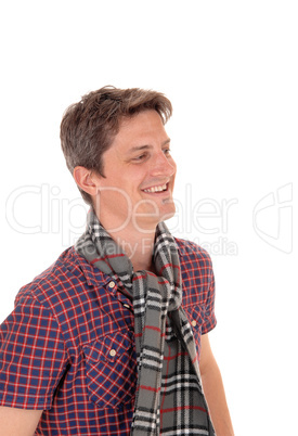 Happy young man in a portrait image smiling