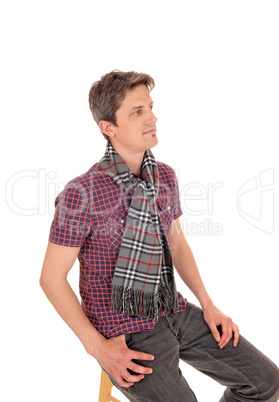 Relaxed young man sitting on chair