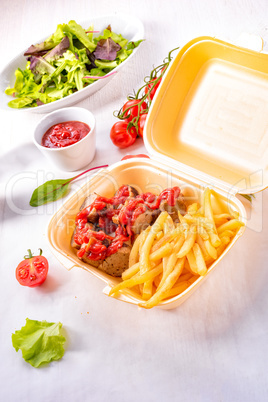 grilled bratwurst with French fries and ketchup