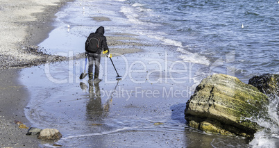 Treasure hunter on a beach