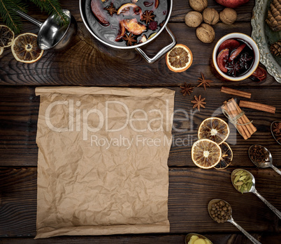 empty scroll of brown paper and ingredients for mulled wine
