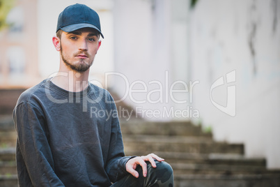 Beautiful young man looking at camera with copy space for text