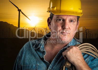 Serious Contractor in Hard Hat Holding Extention Cord Outdoors N