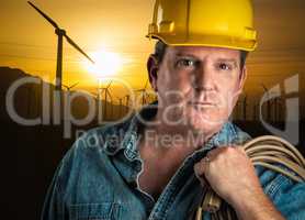 Serious Contractor in Hard Hat Holding Extention Cord Outdoors N