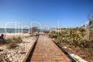 Boardwalk across the white sand beach of Delnor-Wiggins Pass Sta