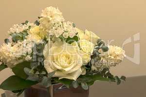 White wedding bouquet of flowers including roses
