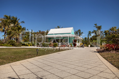 Caribbean style bright green garden cottage at the Naples Botani