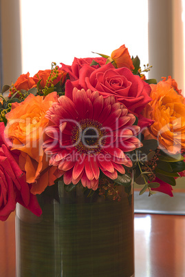 Orange and pink rose and daisy flowers