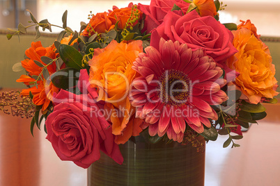 Orange and pink rose and daisy flowers