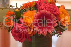 Orange and pink rose and daisy flowers