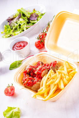 grilled bratwurst with French fries and ketchup