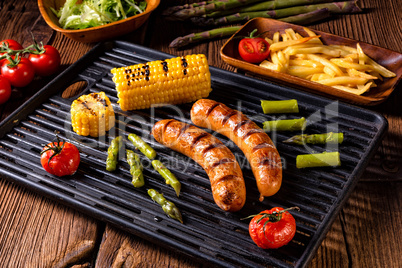 grilled krakauer with french fries and green salad