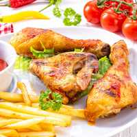 Grilled chicken wings,legs,chips and vegetables