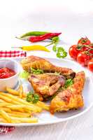 Grilled chicken wings,legs,chips and vegetables