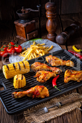 Rustic Grilled chicken wings,legs,and spicy corn