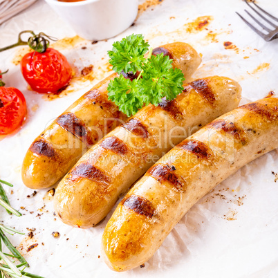 delicious bratwurst with ketchup and fresh rolls