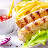 grilled bratwurst with chips and cold beer