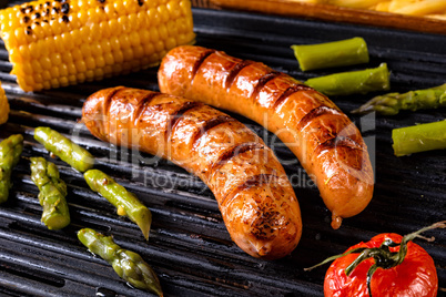 grilled krakauer with french fries and green salad