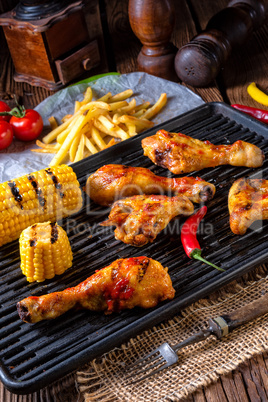 Rustic Grilled chicken wings,legs,and spicy corn