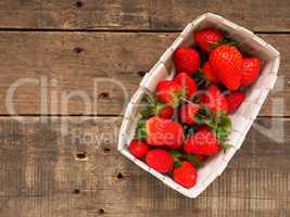 Fresh organic strawberries in a white basket