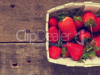 Fresh organic strawberries in a white basket