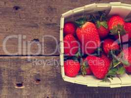 Fresh organic strawberries in a white basket