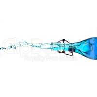 Splashing bottle with blue drink