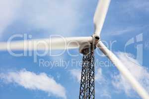 Single Wind Turbine Over Dramatic Blue Sky