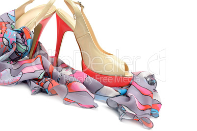 Elegant sandals and scarf isolated on white background.