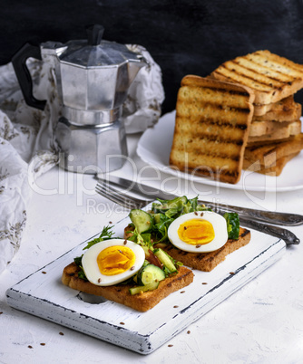 pieces of bread from white wheat flour with boiled egg