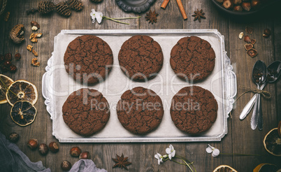 baked round chocolate chip cookies on a silver plate