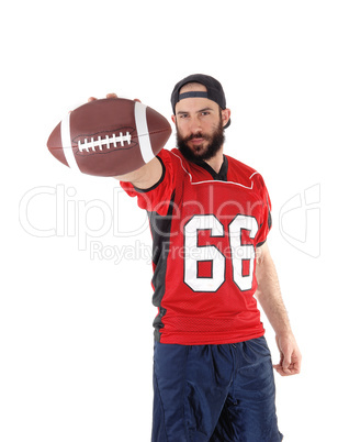 A football player in his jersey throwing the ball