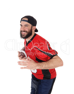 Closeup of a football player with his football in his hand