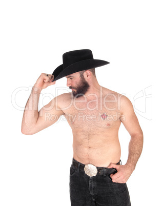 Shirtless man with a cowboy hat, looking away