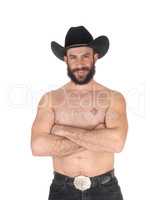 Shirtless man with a cowboy hat looking at the camera