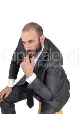 Business man with hand on chin thinking