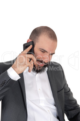 Smiling man with beard on the cell phone