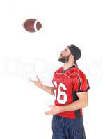 Football player playing with his football