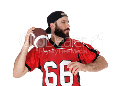 Closeup of a football player with his football in his hand