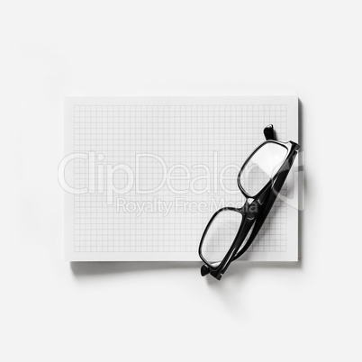 Copybook and glasses