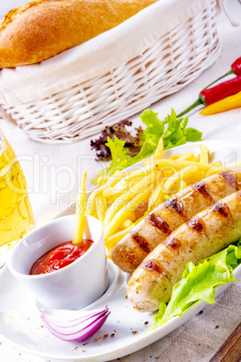 grilled bratwurst with chips and cold beer