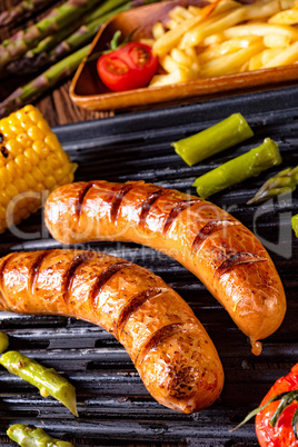 grilled krakauer with french fries and green salad