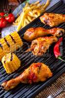 Rustic Grilled chicken wings,legs,and spicy corn