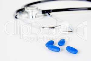 Stethoscope and pills