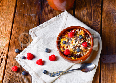 rustic muesli breakfast with forest fruits