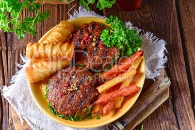 grilled bullets with croquettes and vegetables